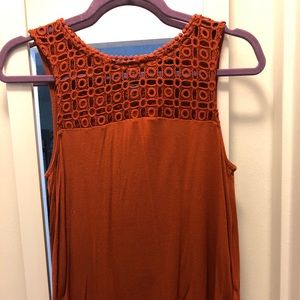 Sleeveless cotton blouse.